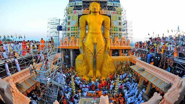 The statue was bathed by devotees using an ‘attanige’ (huge scaffolding) erected for the purpose, with libations such as water, coconut water, sugarcane juice, milk, rice flour, turmeric paste and precious stones, amidst the chanting of hymns. (PTI) The statue was bathed by devotees using an ‘attanige’ (huge scaffolding) erected for the purpose, with libations such as water, coconut water, sugarcane juice, milk, rice flour, turmeric paste and precious stones, amidst the chanting of hymns. (PTI)