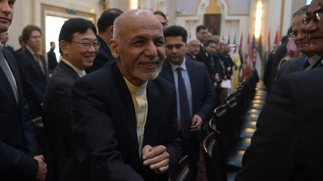 Afghan president Ashraf Ghani shakes hands with a foreign delegate at the second Kabul Process conference at the Presidential Palace in Kabul on February 28, 2018.(AFP Photo)