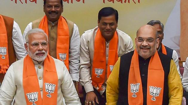 Prime Minister Narendra Modi and BJP president Amit Shah with chief ministers of BJP-ruled states at party headquarters in New Delhi on Wednesday. (PTI Photo) Prime Minister Narendra Modi and BJP president Amit Shah with chief ministers of BJP-ruled states at party headquarters in New Delhi on Wednesday. (PTI Photo)