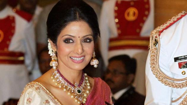 Sridevi Kapoor, who is seen receiving Padma Shri from the then President Pranab Mukherjee at Padma Awards 2013, was wrapped in a red and golden Kajeevaram sari when her mortal remains were kept at Celebration Sports Club in Mumbai for the last darshan.(PTI)