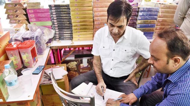 A food safety officer examines samples of sweets at a shop in Palam Vihar, Gurgaon. (Sanjeev Verma/HT PHOTO) A food safety officer examines samples of sweets at a shop in Palam Vihar, Gurgaon. (Sanjeev Verma/HT PHOTO)