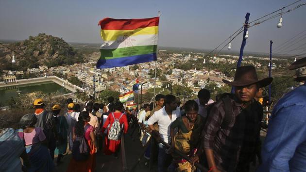 Pilgrims visit the shrine of Gomateshwara.The rituals began with priests and devotees carrying 108 holy vessels from the Digambara Jain mutt to the Vindyagiri hills, the venue of the event. As many as 1008 vessels will be used for the Mahamastakabhisheka. (Aijaz Rahi / AP) Pilgrims visit the shrine of Gomateshwara.The rituals began with priests and devotees carrying 108 holy vessels from the Digambara Jain mutt to the Vindyagiri hills, the venue of the event. As many as 1008 vessels will be used for the Mahamastakabhisheka. (Aijaz Rahi / AP)