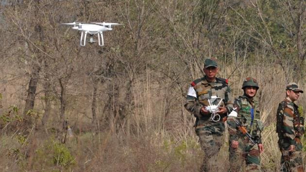 Indian Army soldiers use drone cameras during a search operation at a residential area of Katli village in Samba, about 40km from Jammu, on February 16.(HT File Photo)