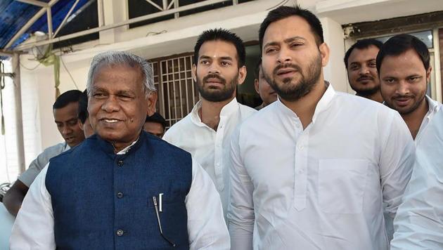 Rashtriya Janata Dal leader Tejashwi Yadav with former Bihar chief minister and Hindustani Awam Morcha (Secular) leader Jitan Ram Manjhi leave after attending a meeting in Patna.(PTI Photo)