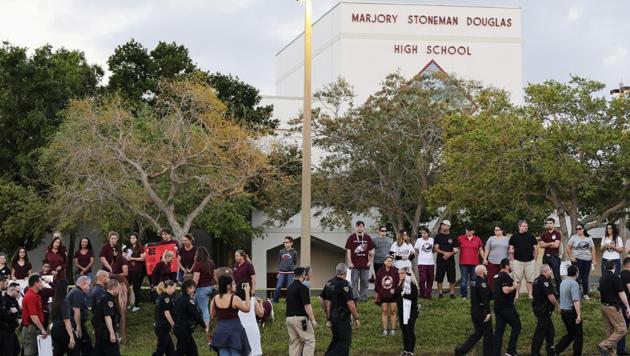 Police walk outside Marjory Stoneman Douglas High School in Parkland, Florida on February 28.(AP Photo)