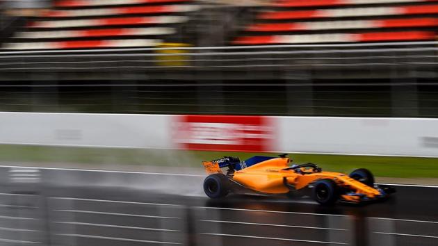 McLaren F1 team's Spanish driver Fernando Alonso drives at the Circuit de Catalunya on Wednesday during the third day of the first week of tests for the Formula One pre-season tests.(AFP)
