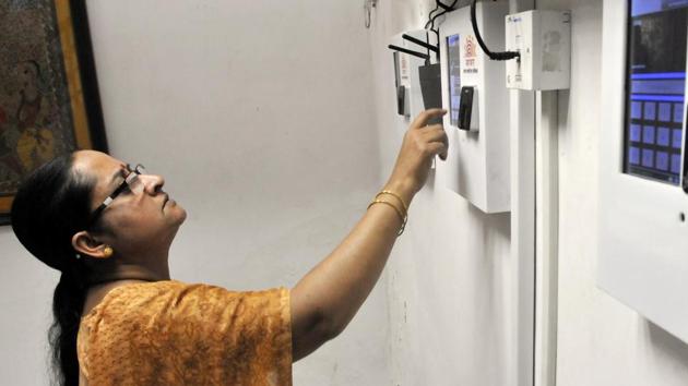 A government employee marks her attendance through an Aadhaar-based system. (Vipin Kumar/HT File Photo) A government employee marks her attendance through an Aadhaar-based system. (Vipin Kumar/HT File Photo)