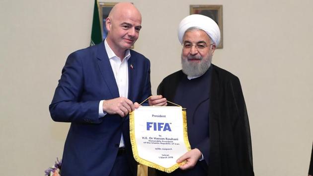 A handout picture released by the office of Iranian President Hassan Rouhani shows him (R) and FIFA president Gianni Infantino in the capital Tehran on March 1, 2018. (AFP) A handout picture released by the office of Iranian President Hassan Rouhani shows him (R) and FIFA president Gianni Infantino in the capital Tehran on March 1, 2018. (AFP)