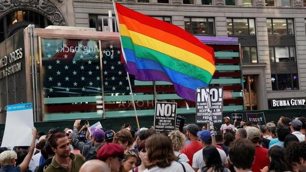 A rainbow flag flies as people protest US President Donald Trump's announcement that he plans to reinstate a ban on transgender individuals from serving in any capacity in the US military, in Times Square, New York City. (Reuters File Photo) A rainbow flag flies as people protest US President Donald Trump's announcement that he plans to reinstate a ban on transgender individuals from serving in any capacity in the US military, in Times Square, New York City. (Reuters File Photo)