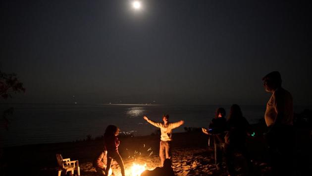 Visitors and residents of Metzoke Dragot gather around a bonfire during a full moon night. While the tourists come and go hermits like Jade, or Mark who has been here for over ten years, are tied firmly to the place. “I’ve found the deepest most amazing healing and peace, the most amazing energy,” Jade said. “This is my life, I’m not leaving.” (Ronen Zvulun / REUTERS) Visitors and residents of Metzoke Dragot gather around a bonfire during a full moon night. While the tourists come and go hermits like Jade, or Mark who has been here for over ten years, are tied firmly to the place. “I’ve found the deepest most amazing healing and peace, the most amazing energy,” Jade said. “This is my life, I’m not leaving.” (Ronen Zvulun / REUTERS)