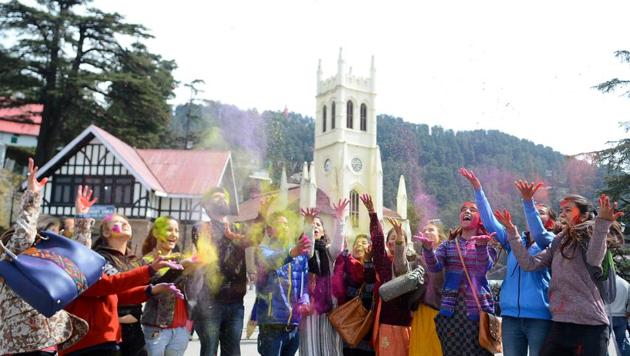 People celebrate the festival of colour at Ridge, Shimla on Thursday. Holi celebrates the advent of spring. (Deepak Sansta /HT) People celebrate the festival of colour at Ridge, Shimla on Thursday. Holi celebrates the advent of spring. (Deepak Sansta /HT)