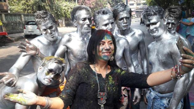 Metallic colours were a hot favourite this year. Here, revellers in Thane pose for a selfie. (praful gangurde)