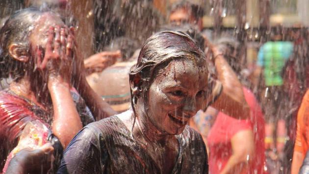 The festival celebrates the arrival of spring as well as the triumph of good over evil. Celebrations are spread across two days with people observing Choti Holi , or Holika Dahan, and Badi Holi, the next day when revellers play with colour and water. Bonfires are lit to represent the destruction of female demon Holika, a symbolic destruction of evil.