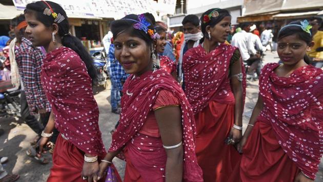 The excitement at the Bhagoria fair in Thandla town in Jhabua district this week was palpable. Young women hoping for a match could be seen dressed in identical clothes and matching jewellery to let people know they belonged to the same village, while being trailed by groups of suitors dressed in their best. (Burhaan Kinu / HT Photo) The excitement at the Bhagoria fair in Thandla town in Jhabua district this week was palpable. Young women hoping for a match could be seen dressed in identical clothes and matching jewellery to let people know they belonged to the same village, while being trailed by groups of suitors dressed in their best. (Burhaan Kinu / HT Photo)