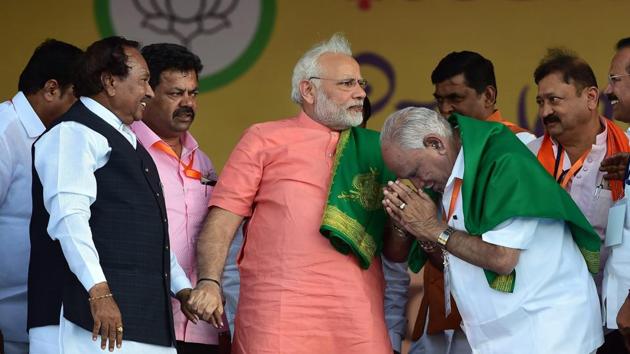 Prime Minister Narendra Modi with Karnataka BJP President, chief ministerial candidate B S Yeddyurappa and party leader K S Eshwarappaduring the party's 'Farmers Convention' at Davanagere, Karnataka. (Shailendra Bhojak / PTI) Prime Minister Narendra Modi with Karnataka BJP President, chief ministerial candidate B S Yeddyurappa and party leader K S Eshwarappaduring the party's 'Farmers Convention' at Davanagere, Karnataka. (Shailendra Bhojak / PTI)