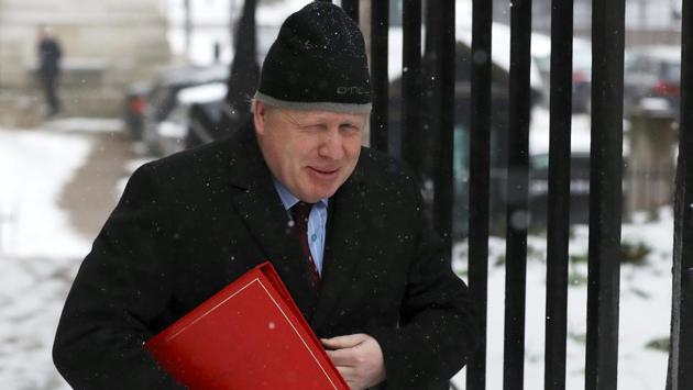 Britain's Foreign Secretary Boris Johnson arrives in Downing Street, London. The Met Office issued a red warning – its most severe alert – on Thursday as temperatures plunged and up to 50cm (20in) of snow fell on high ground. Forecasters said the harsh conditions could continue in some places into next week. (Simon Dawson / REUTERS)