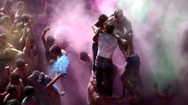 Devotees and tourists celebrate Holi in Pushkar, Rajasthan. Colour-smeared people greeted each other and spread happiness, as the whole country celebrated Holi with great fervour on Friday. (Himanshu Sharma / AFP) Devotees and tourists celebrate Holi in Pushkar, Rajasthan. Colour-smeared people greeted each other and spread happiness, as the whole country celebrated Holi with great fervour on Friday. (Himanshu Sharma / AFP)