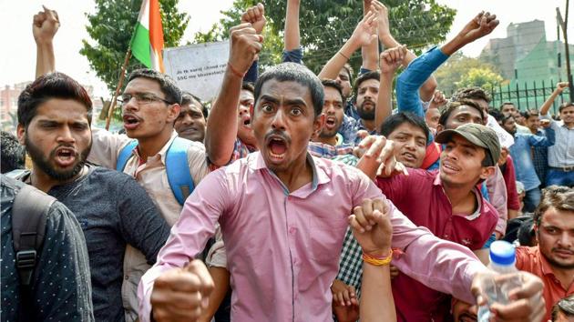 Staff Selection Commission (SSC) aspirants stage a protest demanding a CBI probe into an alleged paper leak outside SSC building, at Lodhi Road in New Delhi. (Arun Sharma / PTI) Staff Selection Commission (SSC) aspirants stage a protest demanding a CBI probe into an alleged paper leak outside SSC building, at Lodhi Road in New Delhi. (Arun Sharma / PTI)