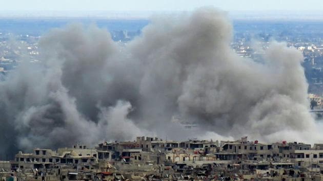 A view from a government-held area in Damascus shows smoke rising from the rebel-held enclave of Eastern Ghouta on the outskirts of the Syrian capital following fresh bombardment. A fledgling "humanitarian pause" announced by Russia in Syria's rebel-held enclave of Eastern Ghouta was rattled by air strikes and rocket fire. (AFP) 