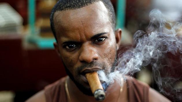 Yosvani Herrera looks on while working at the H. Upmann cigar factory during the XX Habanos Festival in Havana, Cuba. (REUTERS) 