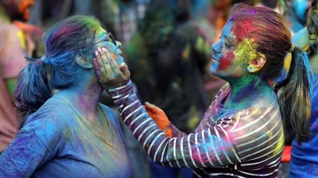 A girl applies colour on another girl during the Holi celebrations at Bibvewadi on Friday. (Rahul Raut/HT PHOTO) A girl applies colour on another girl during the Holi celebrations at Bibvewadi on Friday. (Rahul Raut/HT PHOTO)
