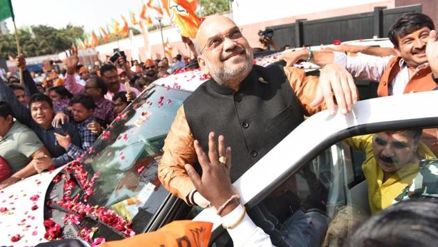 Amit Shah, national president of the Bharatiya Janata Party (BJP), celebrates with supporters outside the BJP headquarters in New Delhi on March 3, 2018. (Sanchit Khanna / HT Photo) Amit Shah, national president of the Bharatiya Janata Party (BJP), celebrates with supporters outside the BJP headquarters in New Delhi on March 3, 2018. (Sanchit Khanna / HT Photo)