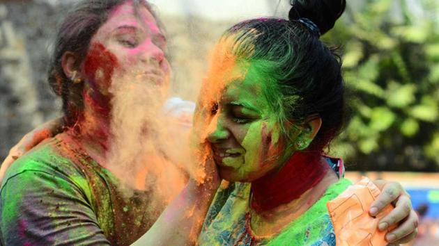 Youngsters playing Holi in the city on Friday. (shankar narayan/ht photo) Youngsters playing Holi in the city on Friday. (shankar narayan/ht photo)