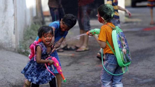Children spray water on each other as part of the Holi celebrations at Sukhasagarnagar in Katraj on Friday. (Rahul Raut/ HT PHoto) Children spray water on each other as part of the Holi celebrations at Sukhasagarnagar in Katraj on Friday. (Rahul Raut/ HT PHoto)
