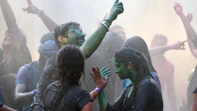 Youngsters celebrate Holi with rain dance at a resort near Bhugaon on Friday. (Pratham Gokhale/HT Photo) 