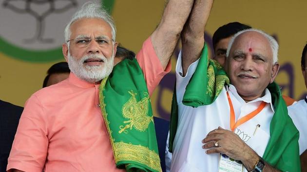 Prime Minister Narendra Modi with Karnataka BJP president and chief ministerial candidate BS Yeddyurappa during the party's 'Farmers Convention' at Davanagere on February 27. (PTI Photo) Prime Minister Narendra Modi with Karnataka BJP president and chief ministerial candidate BS Yeddyurappa during the party's 'Farmers Convention' at Davanagere on February 27. (PTI Photo)