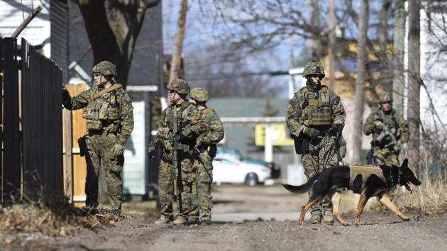 Law enforcement officers search for a suspect involved in a shooting at a Central Michigan University residence hall on Friday, March 2, 2018 in Mt. Pleasant, Michigan (AP) Law enforcement officers search for a suspect involved in a shooting at a Central Michigan University residence hall on Friday, March 2, 2018 in Mt. Pleasant, Michigan (AP)