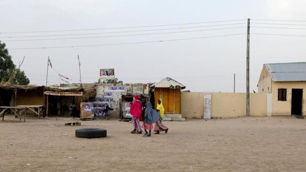Women walk along a street in Yobe State, Nigeria. Despite frequently claiming victory over Boko Haram, and making some inroads against them, President Muhammadu Buhari’s government and the armed forces have failed to wrest back control of the north-east. Boko Haram had at one point held a swathe of territory in Nigeria’s northeast around the size of Belgium. (Afolabi Sotunde / REUTERS) Women walk along a street in Yobe State, Nigeria. Despite frequently claiming victory over Boko Haram, and making some inroads against them, President Muhammadu Buhari’s government and the armed forces have failed to wrest back control of the north-east. Boko Haram had at one point held a swathe of territory in Nigeria’s northeast around the size of Belgium. (Afolabi Sotunde / REUTERS)