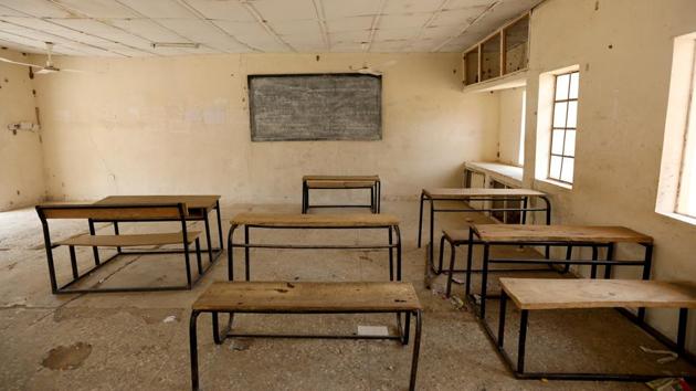 Messages daubed on walls, blackboards and rows of empty bunk beds provide a glimpse of school life while missing ceiling tiles in a dusty classroom hint at the poverty that is rife in northeast Nigeria. (Afolabi Sotunde / REUTERS) Messages daubed on walls, blackboards and rows of empty bunk beds provide a glimpse of school life while missing ceiling tiles in a dusty classroom hint at the poverty that is rife in northeast Nigeria. (Afolabi Sotunde / REUTERS)