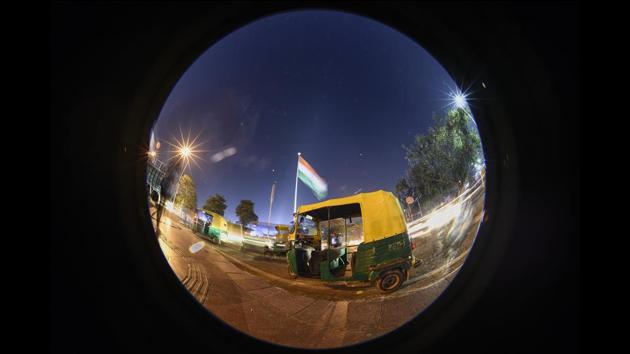 Seen behind the autorickshaw, the 207-foot-tall flag at Central Park in CP was installed by the Flag Foundation of India, a Delhi-based nonprofit set up by Indian steel magnate Naveen Jindal to encourage Indians to feel proud to fly the national flag. (Burhaan Kinu / HT Photo) Seen behind the autorickshaw, the 207-foot-tall flag at Central Park in CP was installed by the Flag Foundation of India, a Delhi-based nonprofit set up by Indian steel magnate Naveen Jindal to encourage Indians to feel proud to fly the national flag. (Burhaan Kinu / HT Photo)