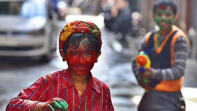 Children playing with colours on Holi in Delhi. (Raj K Raj/HT FILE) Children playing with colours on Holi in Delhi. (Raj K Raj/HT FILE)