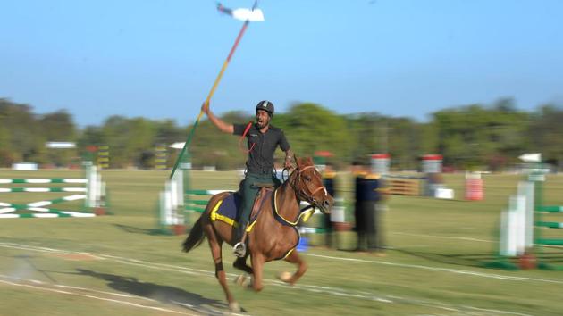 An Indian army soldier performs during a tent pegging event at the Bangalore Horse Show organised by the Indian Army's ASC Centre and College. (Manjunath Kiran / AFP) An Indian army soldier performs during a tent pegging event at the Bangalore Horse Show organised by the Indian Army's ASC Centre and College. (Manjunath Kiran / AFP)