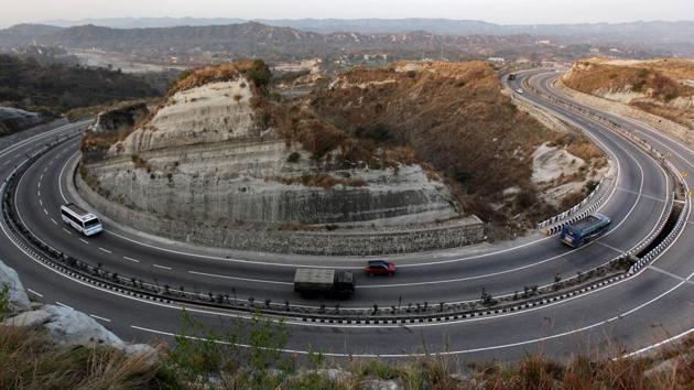 Vehicles travel on the Jammu-Srinagar highway in Jammu on February 1. The traffic on the highway had been restricted to one way for a fortnight and only Jammu-bound vehicles were allowed to run on the road from Srinagar Saturday morning. (AFP File Photo) Vehicles travel on the Jammu-Srinagar highway in Jammu on February 1. The traffic on the highway had been restricted to one way for a fortnight and only Jammu-bound vehicles were allowed to run on the road from Srinagar Saturday morning. (AFP File Photo)