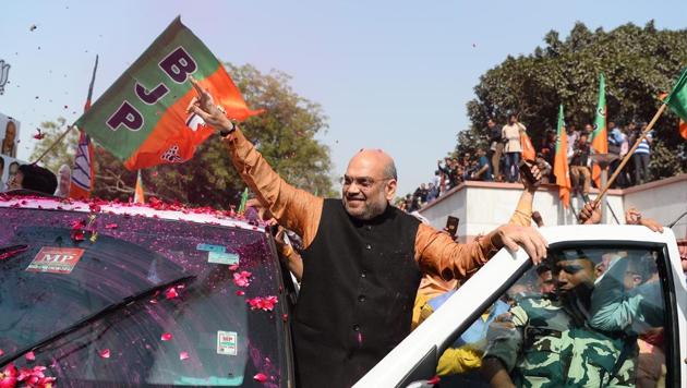 Amit Shah, president of the Bharatiya Janata Party (BJP), celebrates with supporters the state election results in three northeast states, outside the BJP headquarters in New Delhi (AFP) Amit Shah, president of the Bharatiya Janata Party (BJP), celebrates with supporters the state election results in three northeast states, outside the BJP headquarters in New Delhi (AFP)