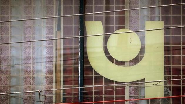 The logo of Punjab National Bank (PNB) is seen on a branch office window in New Delhi. The logo of Punjab National Bank (PNB) is seen on a branch office window in New Delhi.