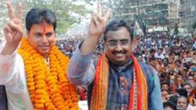 BJP national general secretary Ram Madhav and Tripura BJP chief Biplab Kumar Deb display victory sign in Agartala on Saturday.(PTI Photo) BJP national general secretary Ram Madhav and Tripura BJP chief Biplab Kumar Deb display victory sign in Agartala on Saturday.(PTI Photo)