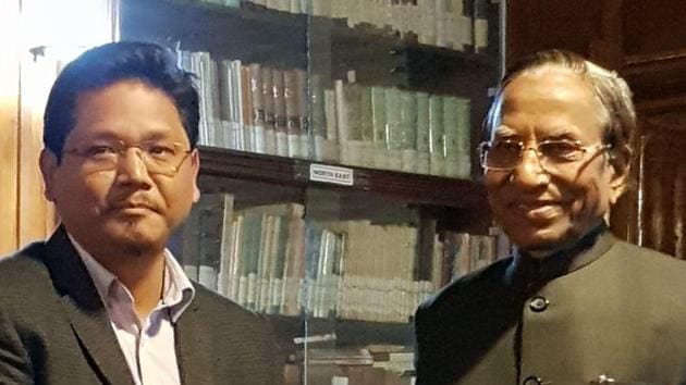 NPP national president Conrad Sangma hands over a letter of support of MLAs to Meghalaya governor Ganga Prasad at Raj Bhawan in Shillong on Sunday. (HT Photo) NPP national president Conrad Sangma hands over a letter of support of MLAs to Meghalaya governor Ganga Prasad at Raj Bhawan in Shillong on Sunday. (HT Photo)