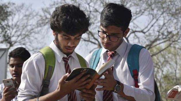 Students outside an exam centre before appearing for their CBSE Class 12 exam at St. Thomas' School in New Delhi on March 9, 2017. (Ravi Choudhary/HT File Photo)
