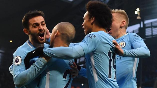 Manchester City's Bernardo Silva (L) celebrates scoring the opening goal with teammates during the English Premier League football match between Manchester City and Chelsea at the Etihad Stadium in Manchester, north west England on March 4, 2018. (AFP) Manchester City's Bernardo Silva (L) celebrates scoring the opening goal with teammates during the English Premier League football match between Manchester City and Chelsea at the Etihad Stadium in Manchester, north west England on March 4, 2018. (AFP)