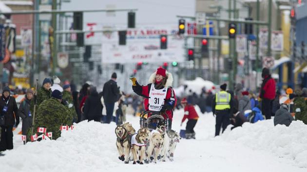 Musher Aliy Zirkle runs her team during the ceremonial start of the Iditarod Trail Sled Dog Race.(AP)