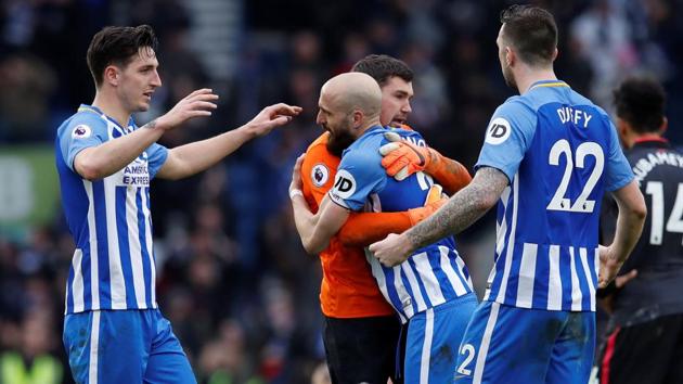 Brighton and Hove Albion's Lewis Dunk and team mates celebrate after scoring against Arsenal on Sunday. (REUTERS) Brighton and Hove Albion's Lewis Dunk and team mates celebrate after scoring against Arsenal on Sunday. (REUTERS)