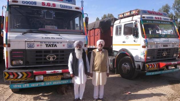 Two residents of Mahian Wala Kalan village with their trucks. (HT Photo) Two residents of Mahian Wala Kalan village with their trucks. (HT Photo)