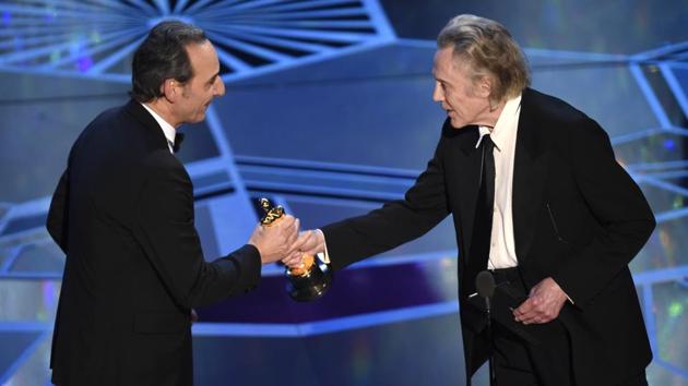 Oscar winner Christopher Walken walked onto the stage to present the award for Best Original Score. Alexandre Desplat won the second award of the evening for the Shape of Water and second Oscar of his career for his lush music for the old-fashioned romantic film. ( Chris Pizzello / Invision / AP)