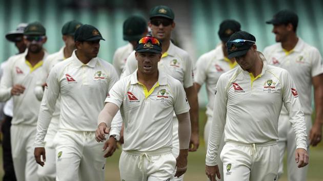 Australia's David Warner, center, leaves the field with teammates at the end of the fifth and final day of the first Test against South Africa at Kingsmead Stadium in Durban. (AP) Australia's David Warner, center, leaves the field with teammates at the end of the fifth and final day of the first Test against South Africa at Kingsmead Stadium in Durban. (AP)
