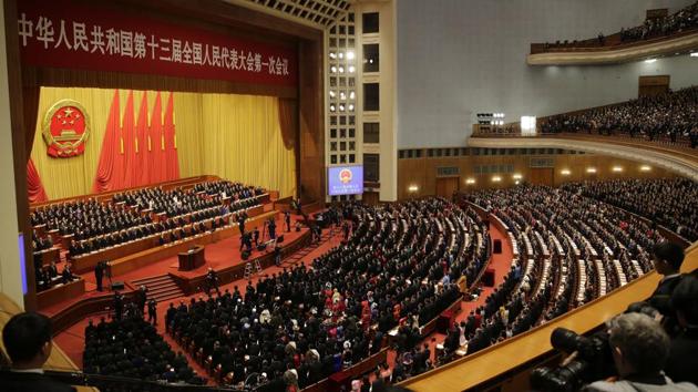 Chinese leaders and delegates stand as the national anthem is played at the opening session of the annual National People's Congress at the Great Hall of the People in Beijing on March 5. (AP Photo) Chinese leaders and delegates stand as the national anthem is played at the opening session of the annual National People's Congress at the Great Hall of the People in Beijing on March 5. (AP Photo)
