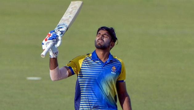 Ravikumar Samarth of Karnataka raises his bat after his century against India B in the Deodhar Trophy match at Dharamshala, Himachal Pradesh on Monday. (PTI) Ravikumar Samarth of Karnataka raises his bat after his century against India B in the Deodhar Trophy match at Dharamshala, Himachal Pradesh on Monday. (PTI)